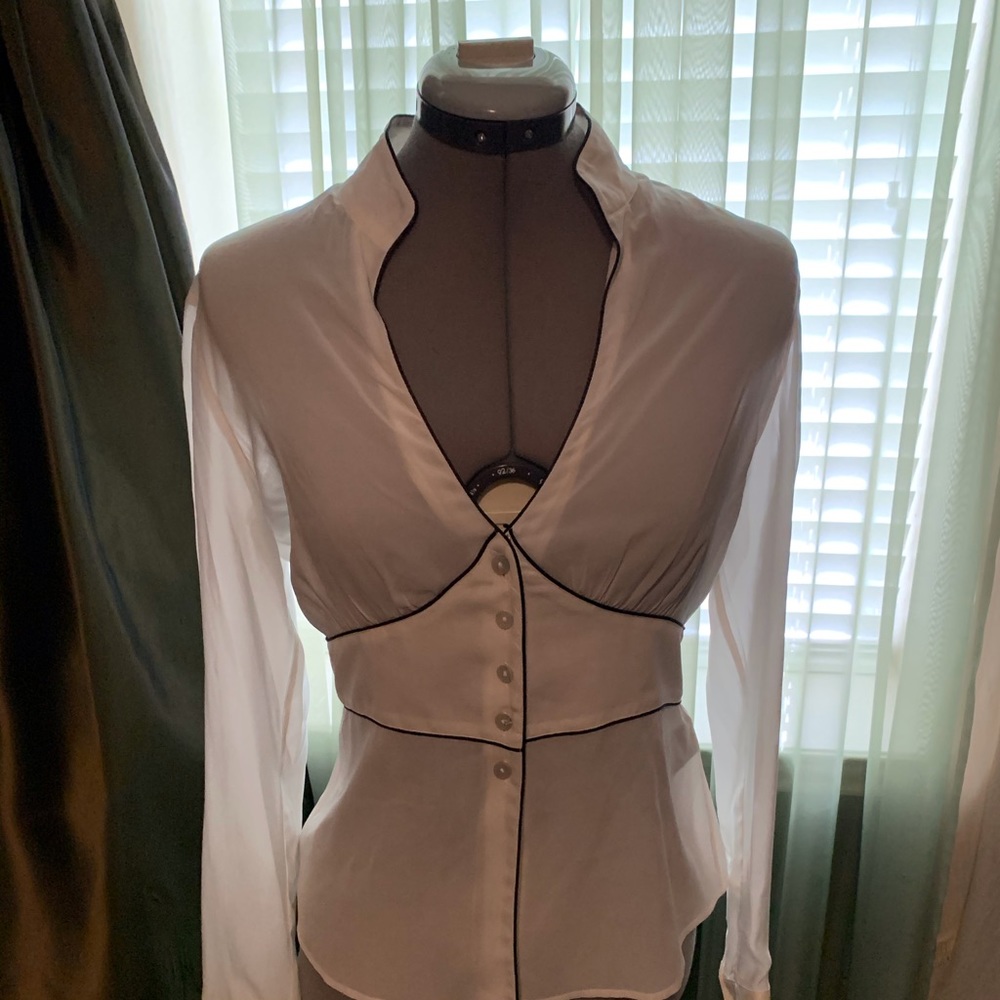 white silk long sleeve blouse with black piping.